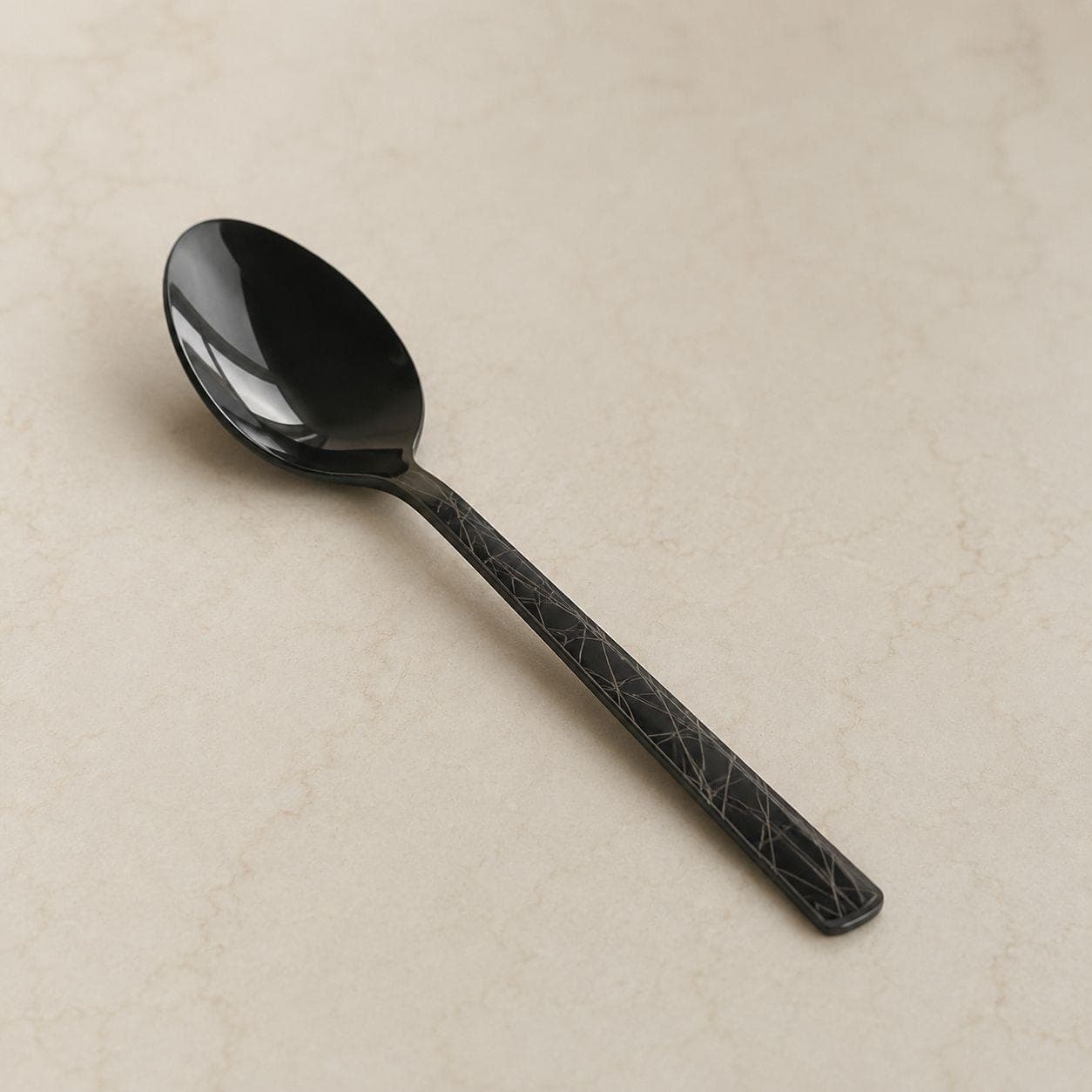 6 black titanium teaspoons with laser pattern, suitable for beverages.