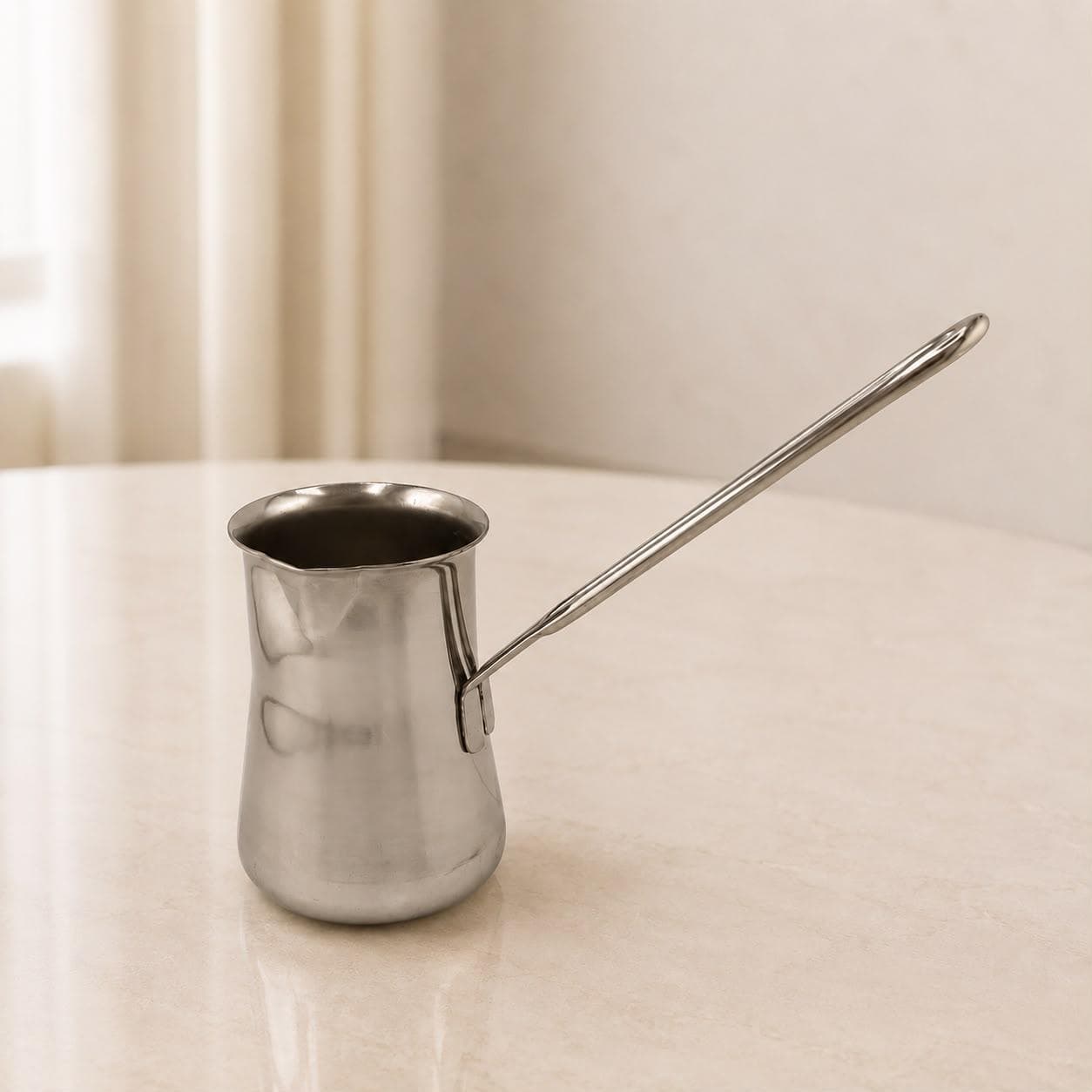 250ml milk cup with a long handle and no lid, ideal for easy pouring and preparation.