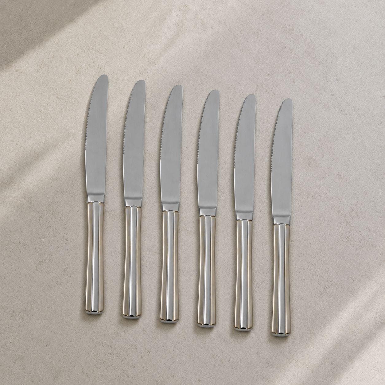 6-piece gold dining knife set with an elegant design, ideal for serving and daily use.