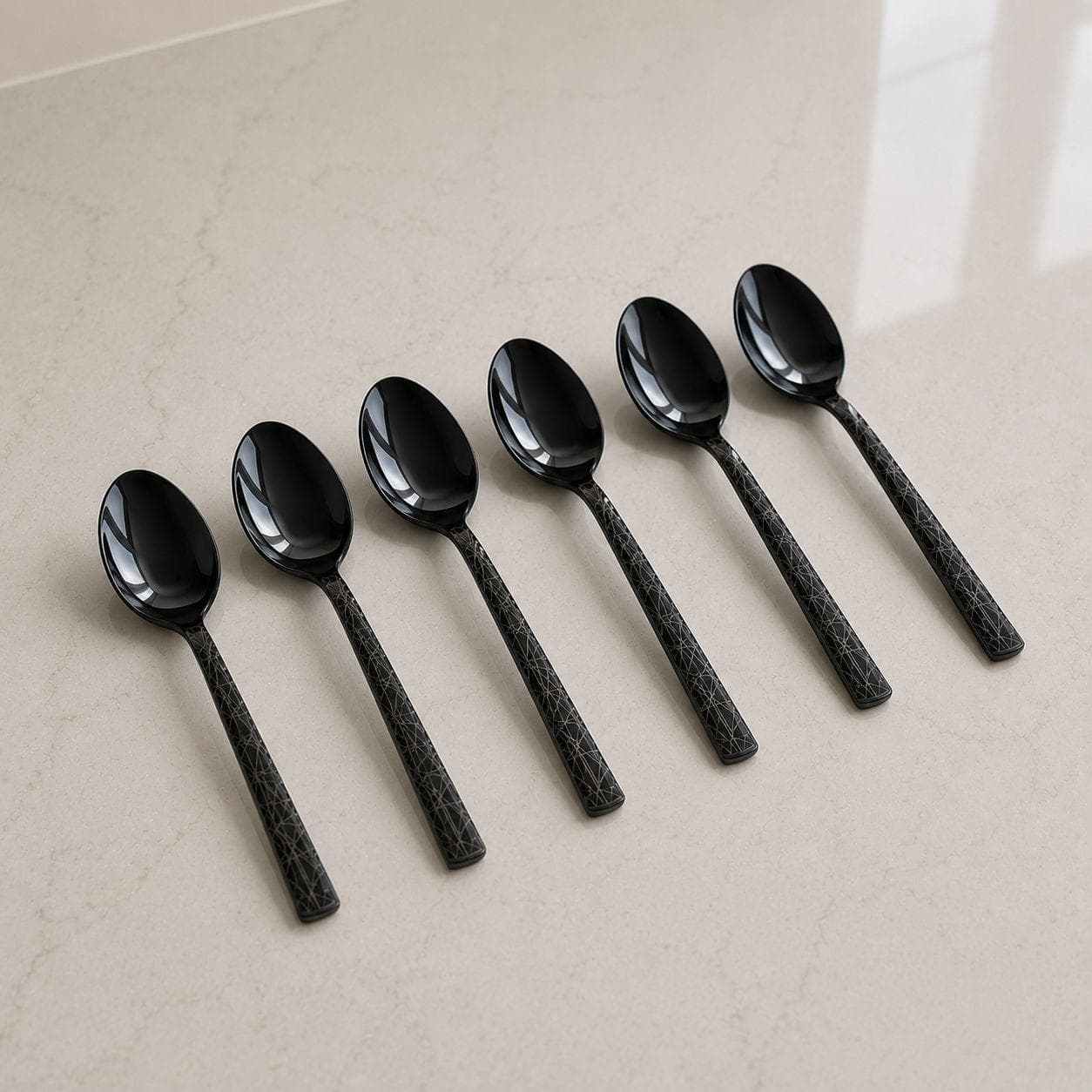 6 black titanium teaspoons with laser pattern, suitable for beverages. 4