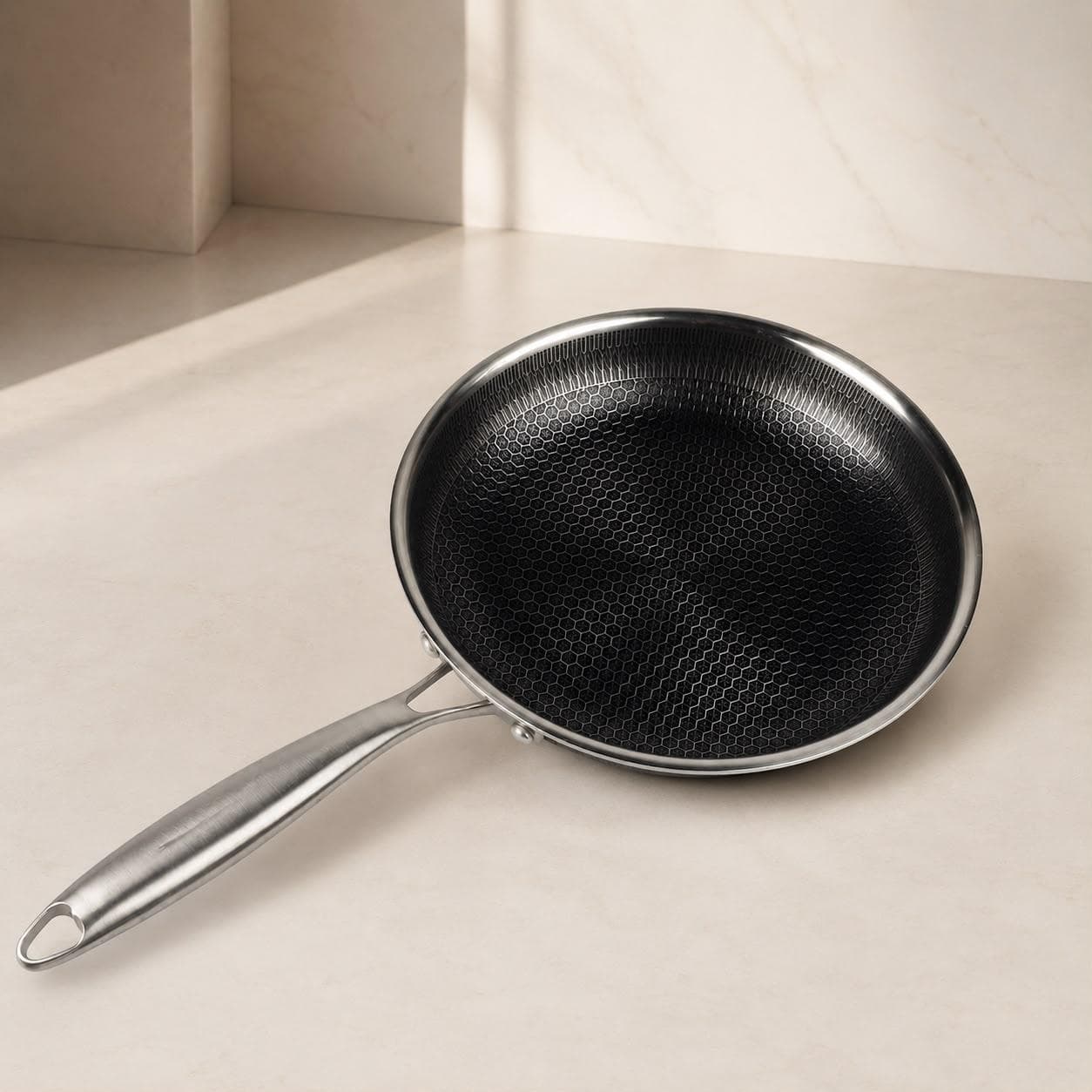 Stainless steel frying pan without lid, textured surface, Size 26 × 5 cm, ideal for quick frying.