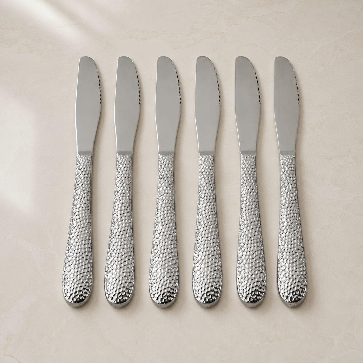 6-piece stainless steel dining knife set with a stylish hammered design, ideal for daily use and serving. 5