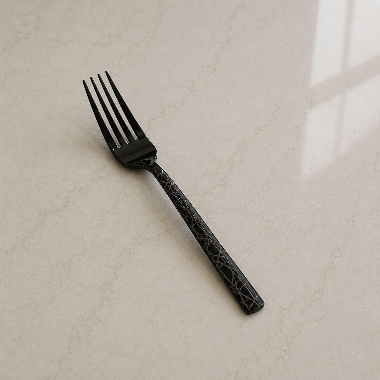 6 black titanium dining forks with laser pattern, suitable for serving food.